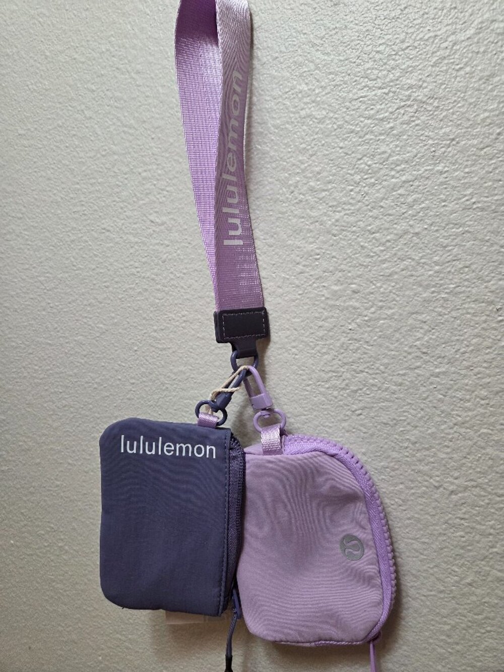 Lululemon Dual Pouch Wristlet featuring two contrasting purple compartments